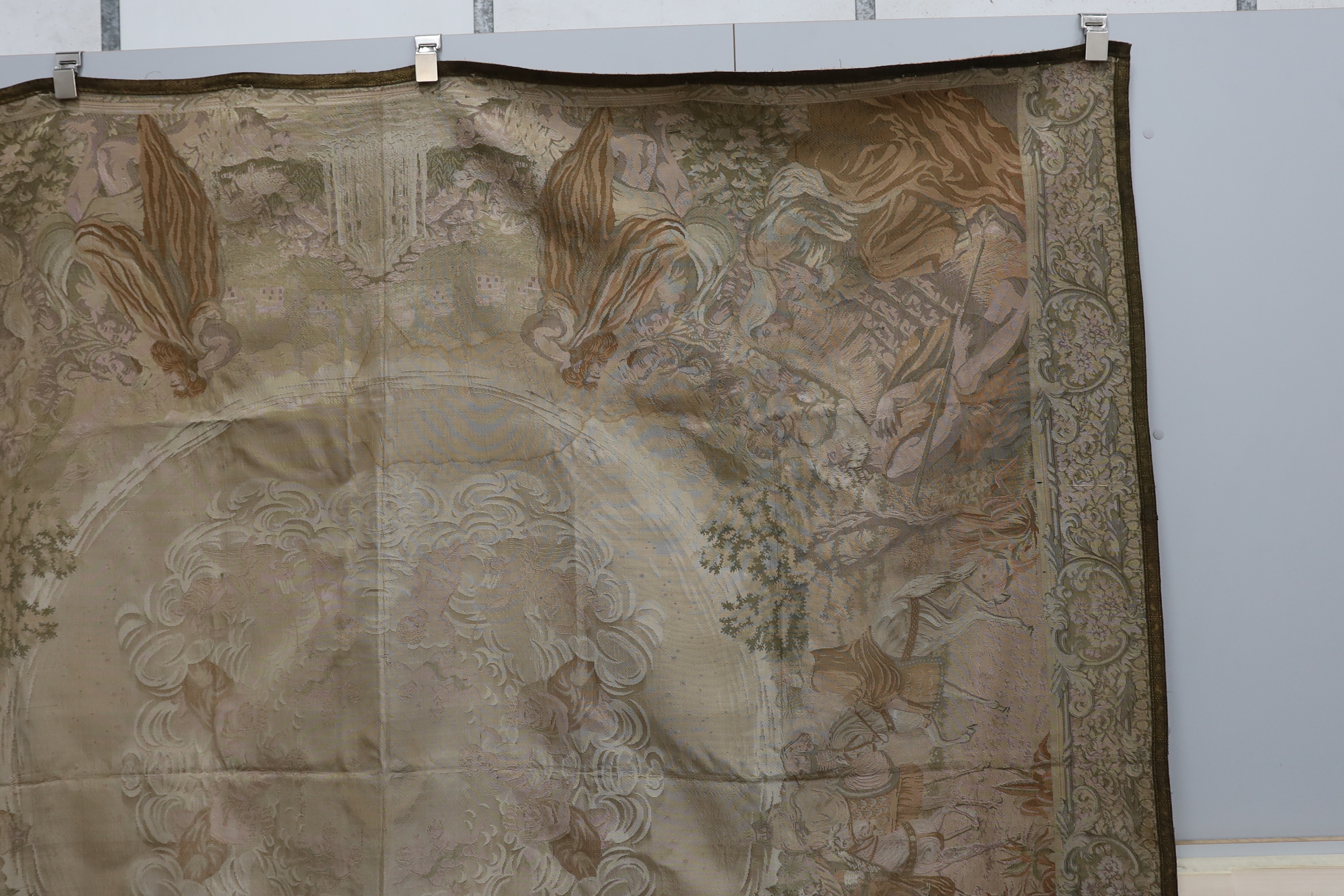 A metallic woven machine tapestry edged in metallic braiding, the tapestry depicting various scenes from the nativity, 225cm x 200cm